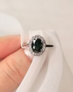 Oval teal sapphire 1.55 carat ring with diamonds 0.16 carats in platinum setting - Image 4
