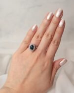 Oval teal sapphire 1.55 carat ring with diamonds 0.16 carats in platinum setting - Image 5